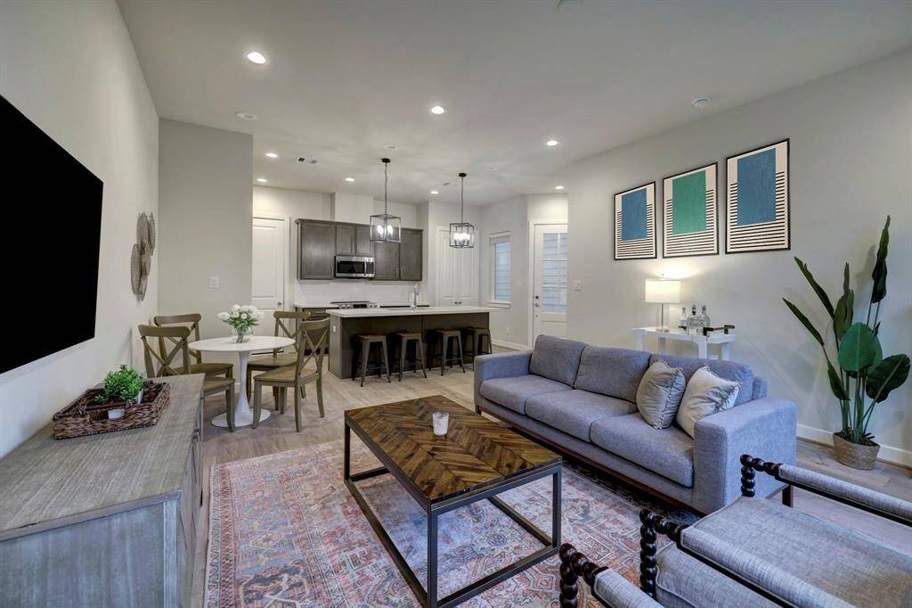 Generous family space exuding a welcoming atmosphere with a simple and light ambiance, perfect for hosting guests.