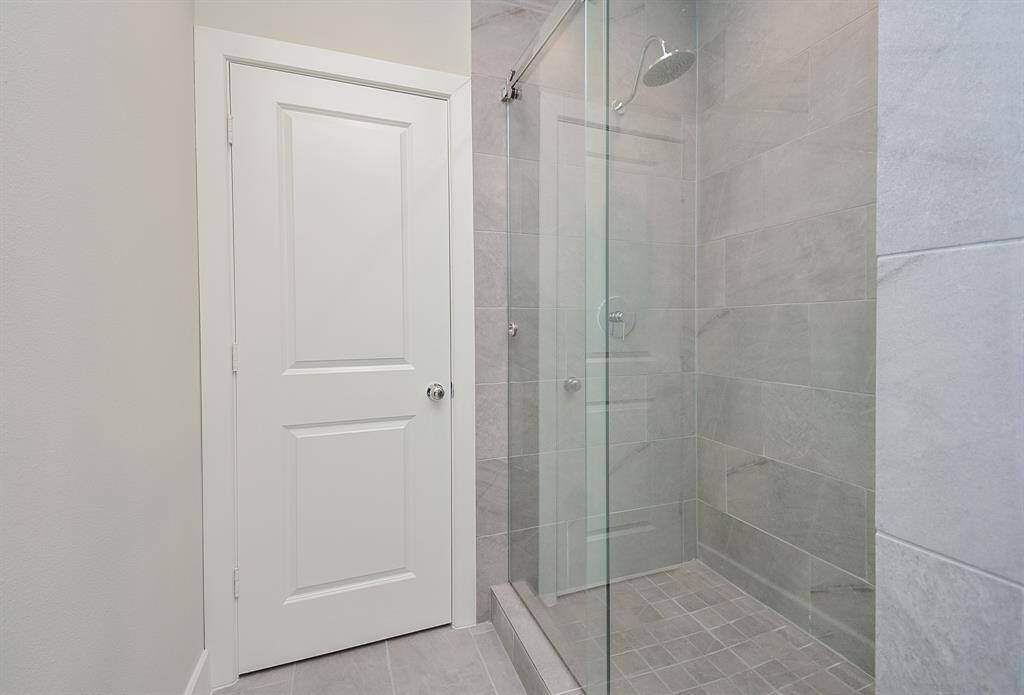 Explore perfectly organized bathrooms adorned with ample cabinetry and abundant lighting.