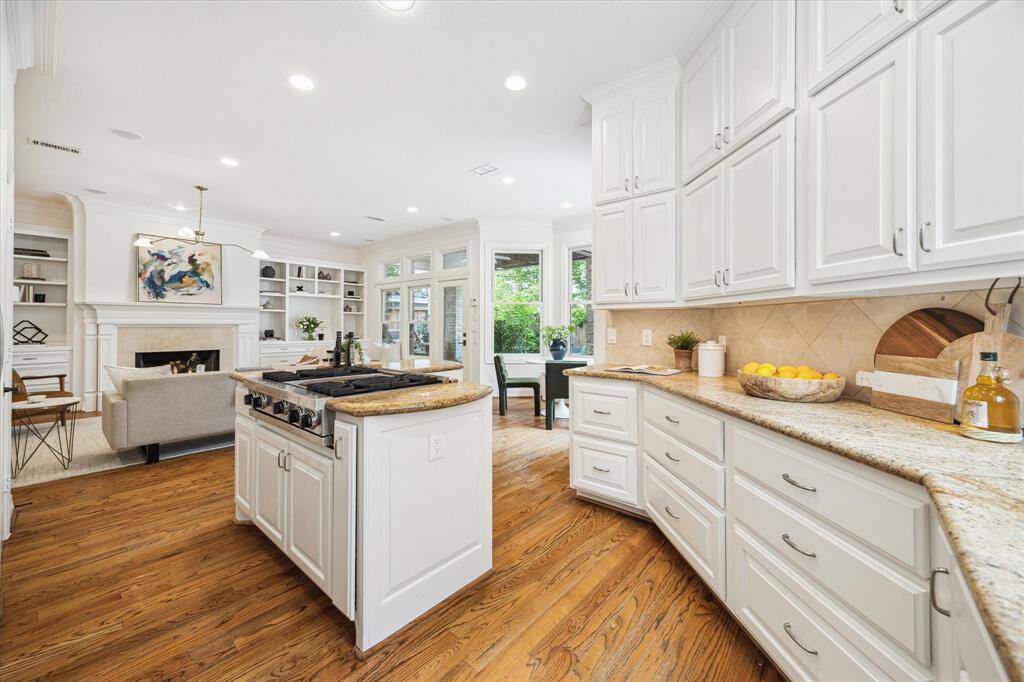 [Kitchen] Open to the family room. Has island with storage, recessed and under cabinet lighting.