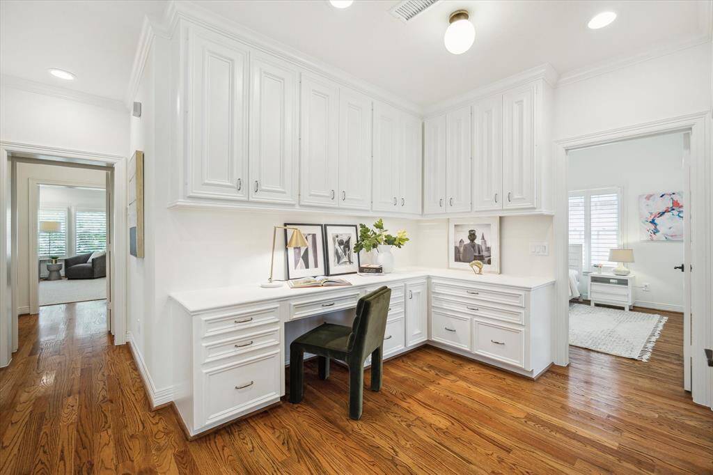[Office Nook] Home office just off second floor landing. Built-in desk, storage cabinets and drawers. Has a window in the stairwell for natural lighting.