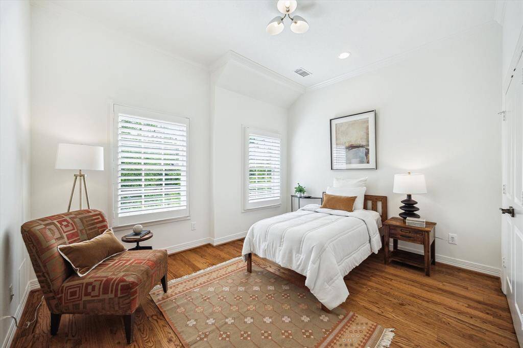 [Secondary Bedroom] One of the three secondary bedrooms - all bedrooms are generous in size with hardwoods and shutters.