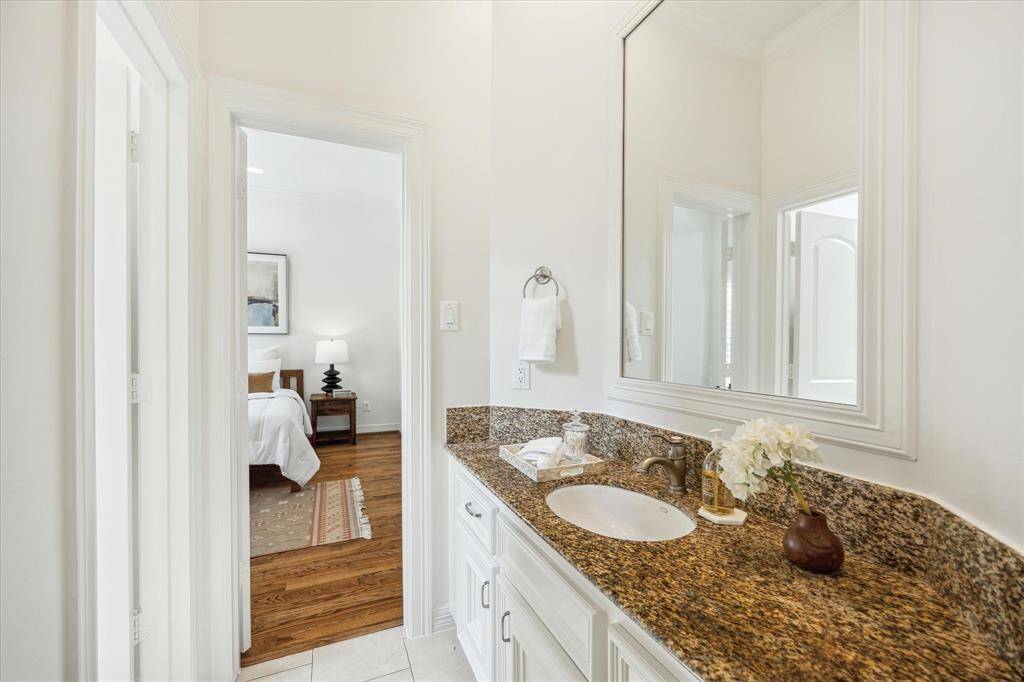 [Secondary Bathroom] One of the two secondary bathrooms. Has granite counters, tub/shower combo.