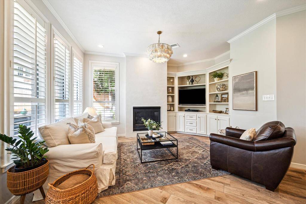 Relax & Unwind – Cozy family room with custom fireplace and designer touches.