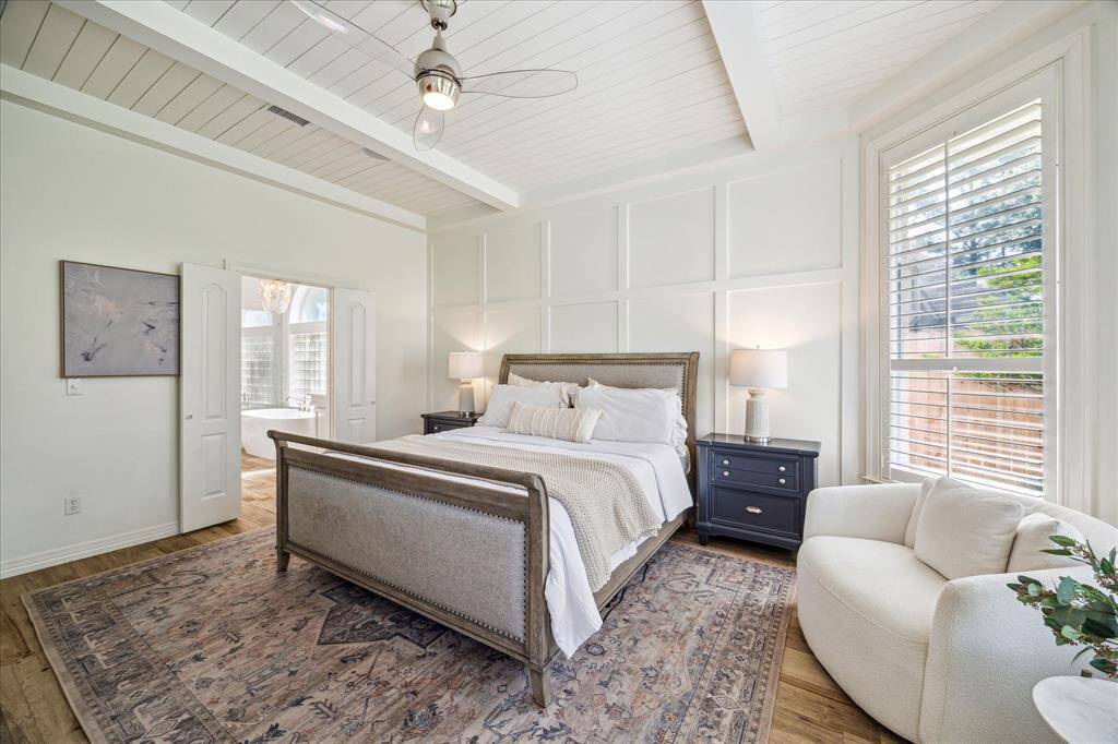 Design Details – Primary bedroom features a shiplap ceiling and accent wall.