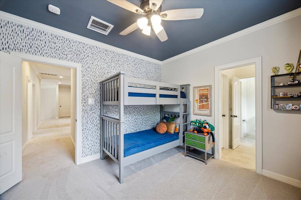 Bedroom Four – Features playful wallpaper and a painted ceiling that adds personality and charm.