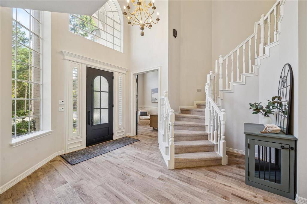 Grand Entrance – Inviting entryway with views of the updated front door and elegant finishes.