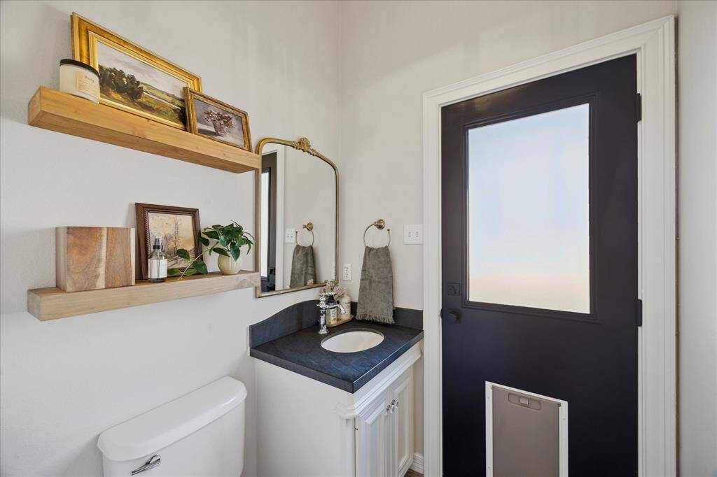 Pool-Ready Powder Room – Second half bath with backyard access—perfect future pool bath!