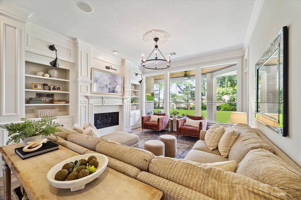 Cozy Gathering Space – Formal living with fireplace and timeless trim details.