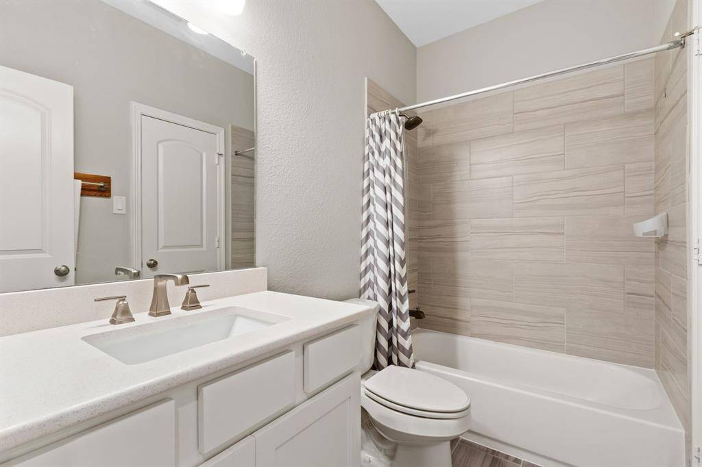 Bedroom 2 boasts en-suite access to a full bath with tub and shower. The finishes and fixtures in the secondary baths are comparable with those you will see downstairs.
