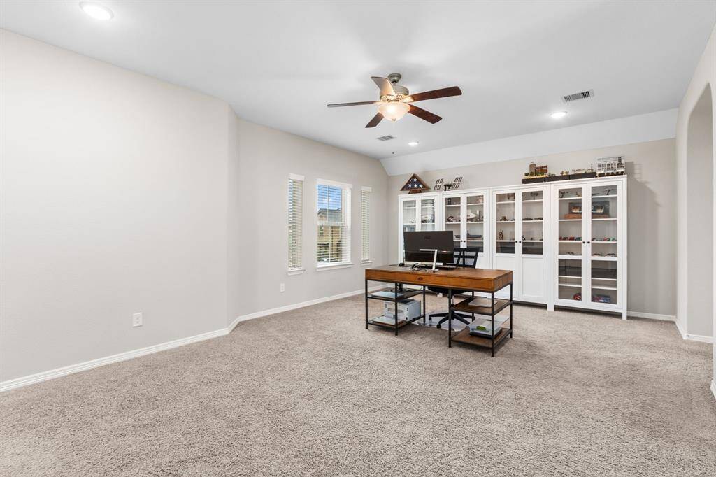 The large game room is currently being used as a work space, due to the quiet location within the home. This room can fit even your largest sectional, or even a game table. Pool or air hockey, anyone?