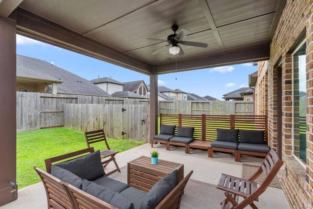 Your covered back patio is ready for grilling season! The spacious backyard has been divided by the current owners to create dedicated play spaces that can be rotated to maintain optimal grass health. The dividing fence can be removed to provide one large yard space, if requested by the Buyer. It was left because this can also create easy separation between pets and playscapes, or play and gardening.