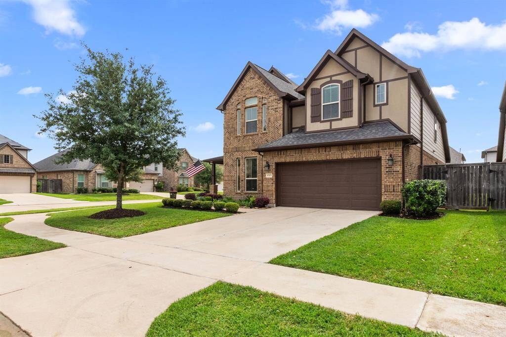 Corner lot? Check! Three car garage? Check! Impressive curb appeal in a gated community zoned to top-ranked schools? Check and check!