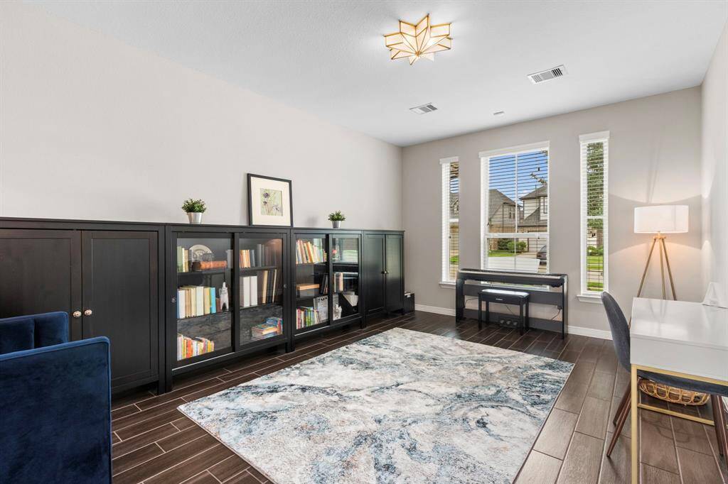 At the front of the home, overlooking the well-cared-for front landscaping is a light and bright flex space that could be a dedicated home office or secondary living room. What would you do with this option in your floorplan?