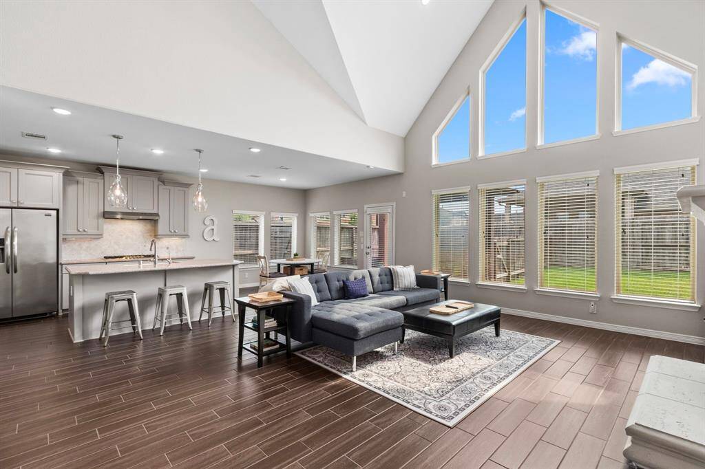 This open-concept floorplan is ideal for daily living and large-scale entertaining. The large living area can accommodate multiple furniture arrangements, and the neutral color scheme works with warm and cool tones. Bring your own design preferences to this space, and you can customize the look of the room simply by adding your pieces...no additional work required!  The gorgeous windows and architectural design so the heavy lifting here, so all you need to do is move in.