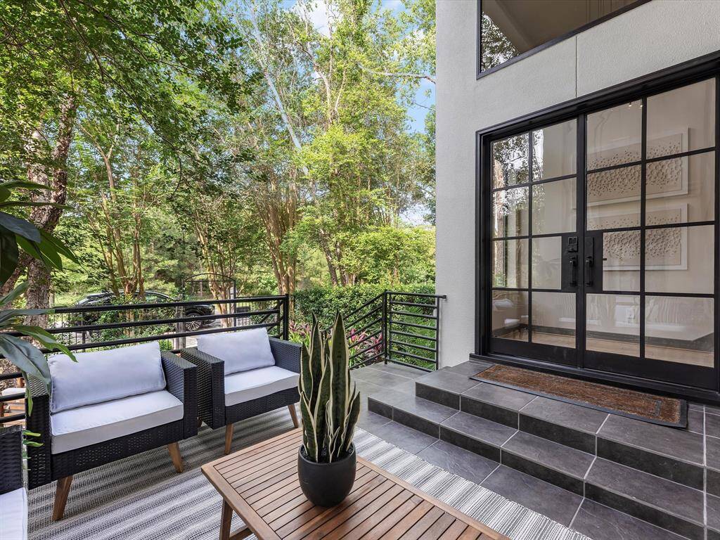 This outdoor "foyer" is a lovely start to the home.