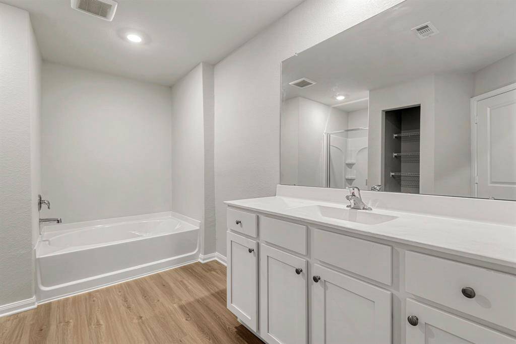 Luxurious primary bathroom with a soaking tub.