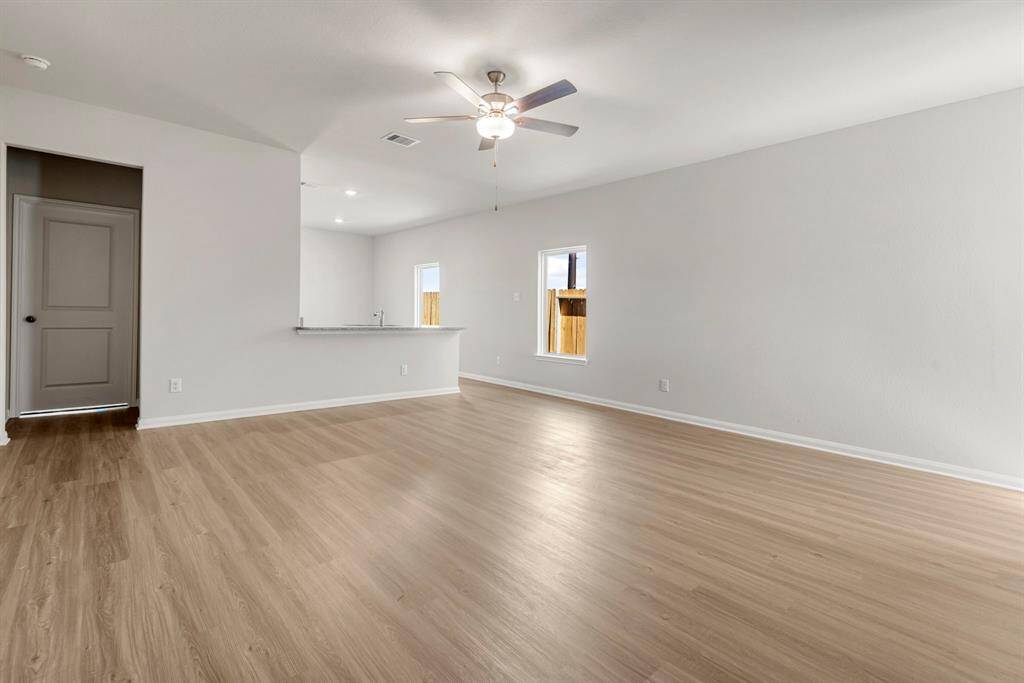 Spacious living room, open to the kitchen and dining area.
