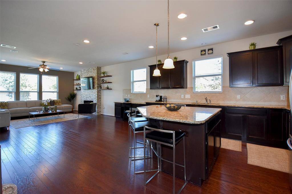 Kitchen island with extra storage and space for 4 bar stools.