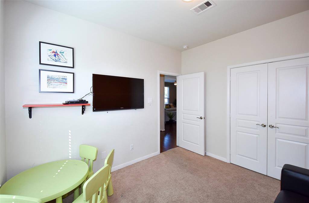 Bedroom on first floor.  Showing as playroom.