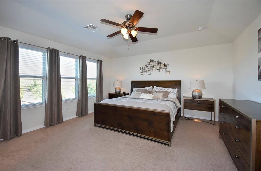 Lots of natural light coming into this primary bedroom.
