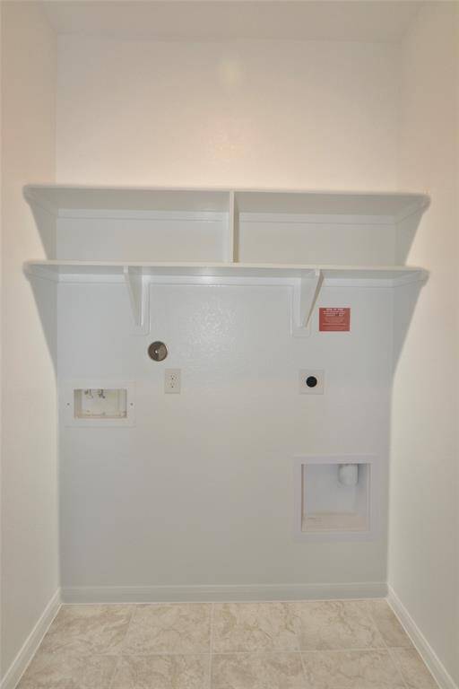 The laundry room features washer/dryer connections