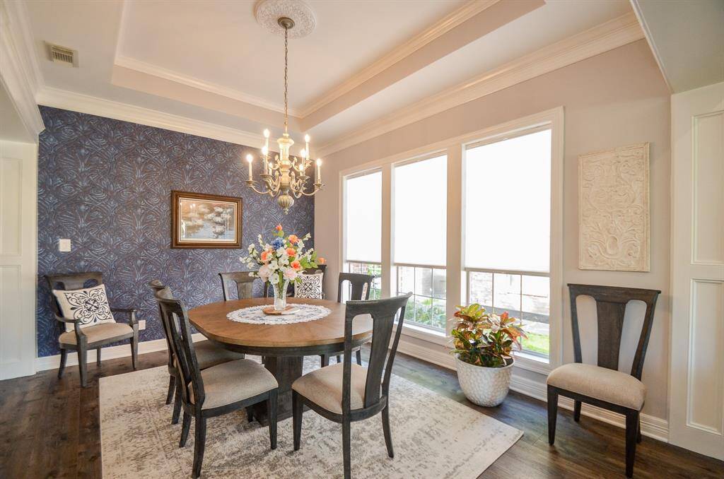 The grand dining room provides plenty of space for entertaining and family dinners.