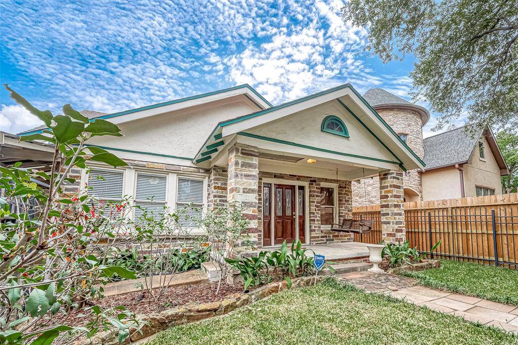 Renovated brick bungalow featuring three bedrooms, 2 1/2 baths, and an attached carport that can accommodate 3 vehicles.