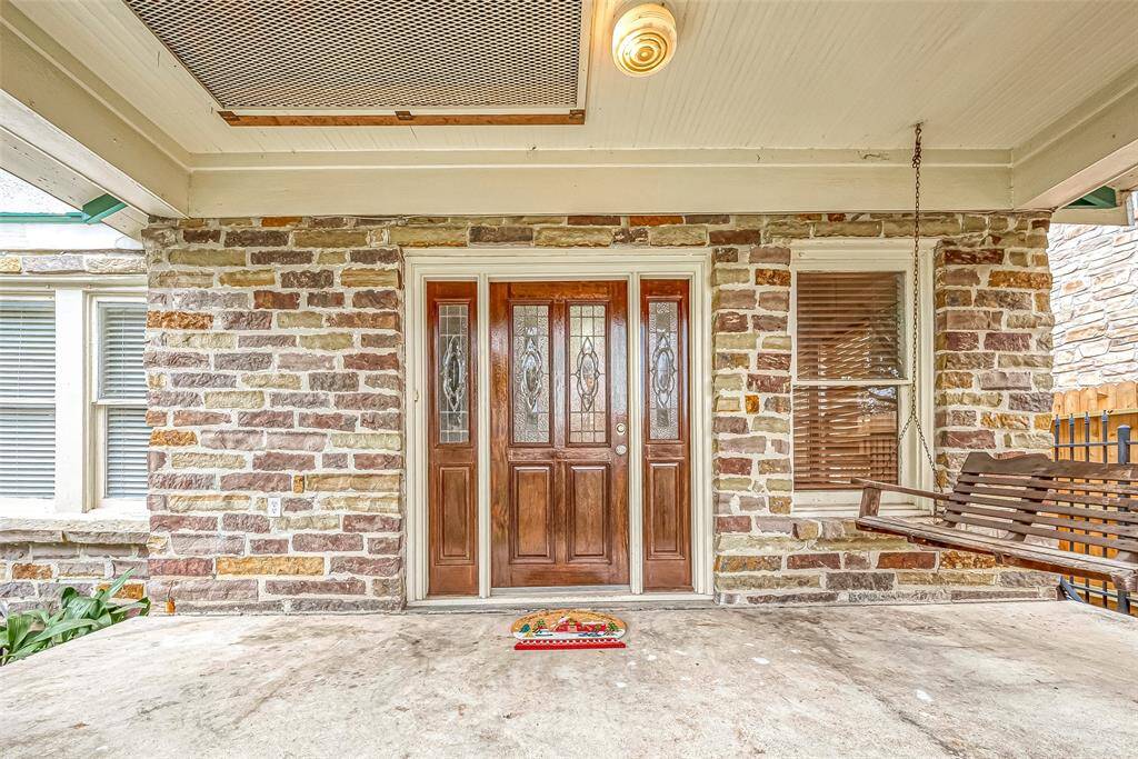 Front porch comes complete with the requisite porch swing!