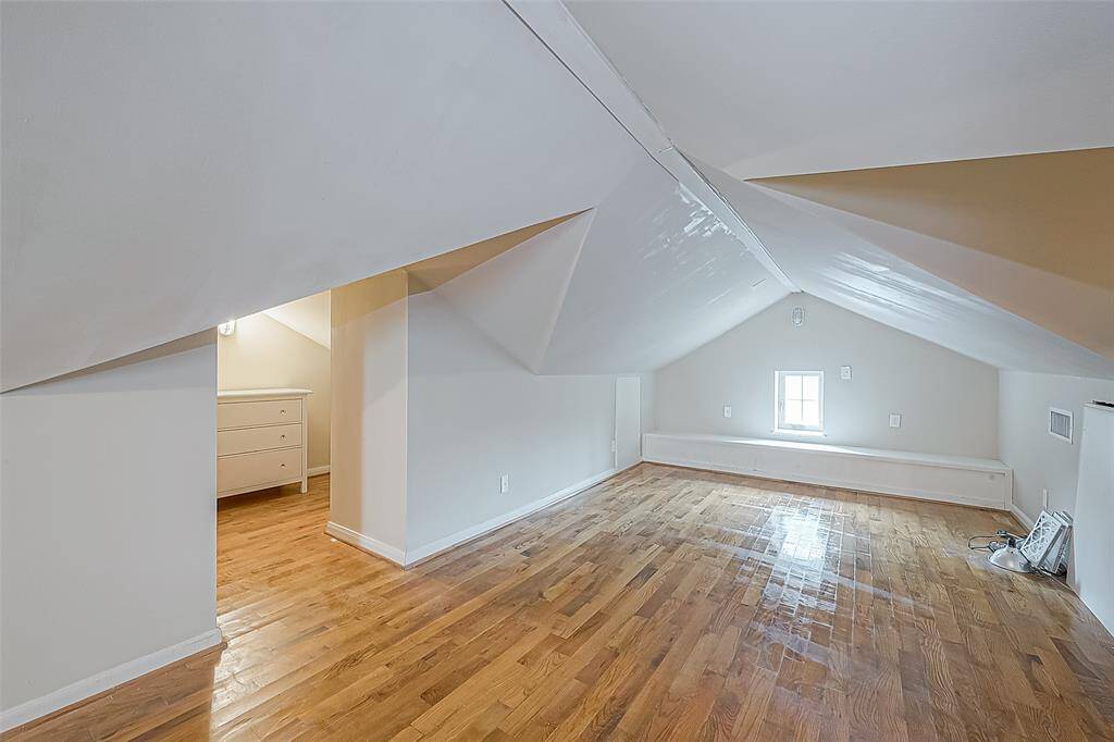The large closet with chest of drawers is partially shown at left.