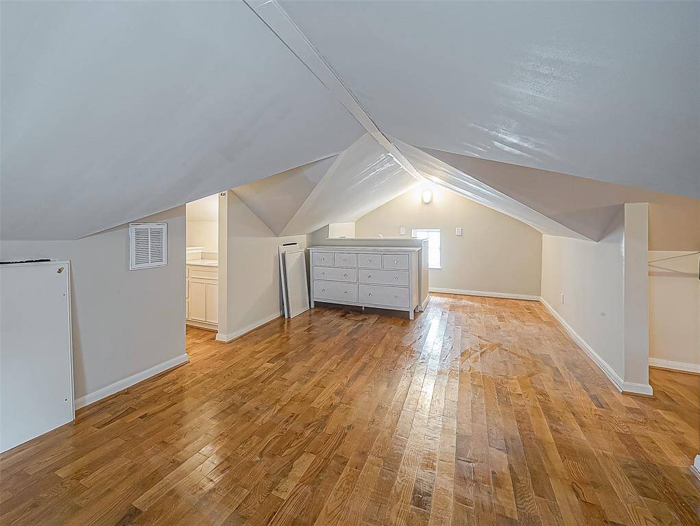 A view from the other end of this bedroom. Not that it also includes a double-width dresser for your use!
