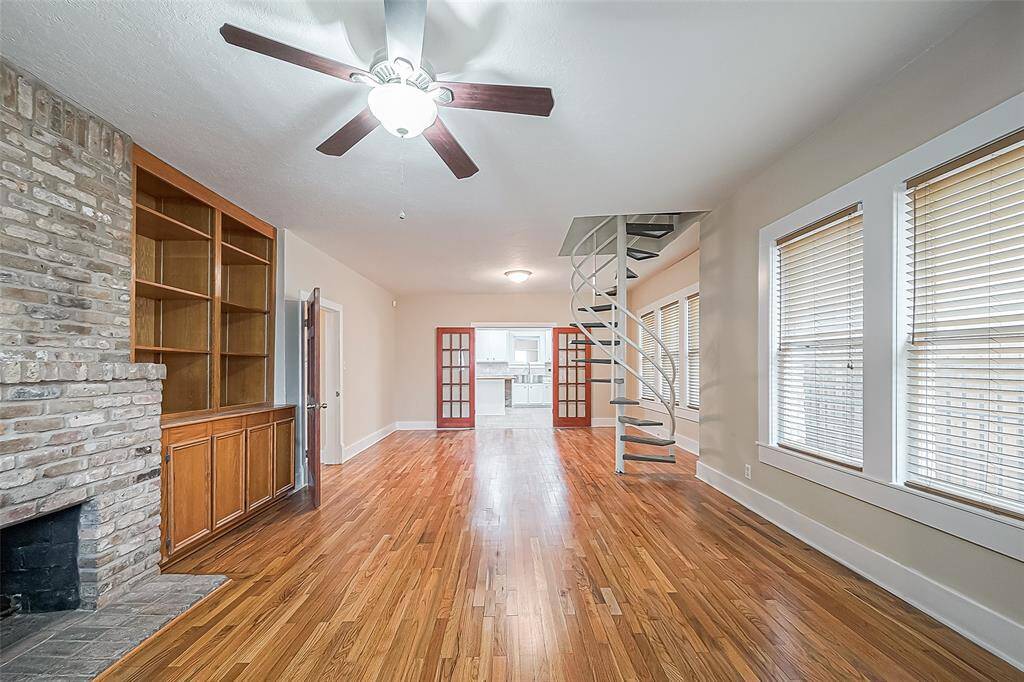 Step inside the front door to this open living and dining layout. Big kitchen shown in background.