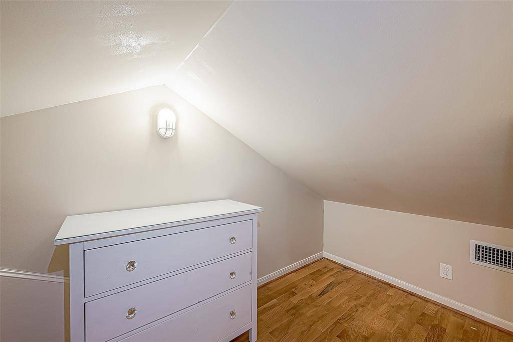 The closet includes a rod for hanging up your clothes as well as this dresser, plus an additional storage area.