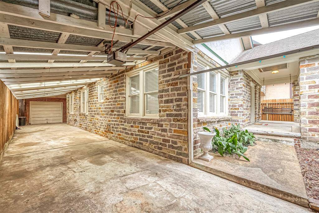 You'll be truly surprised at how much covered space there is behind the garage door -- it can accommodate about 3 vehicles.