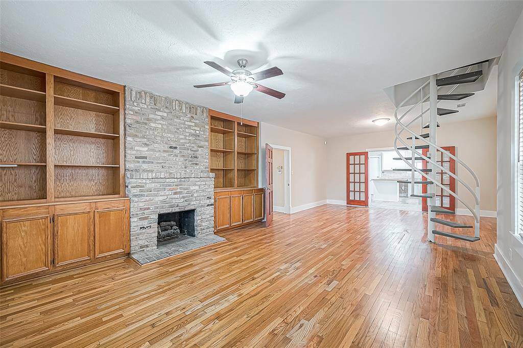 Built-in's surround the gas log fireplace. Spiral staircase goes to the third bedroom suite. The entire home has just been painted -- it's fresh and ready for move-in.