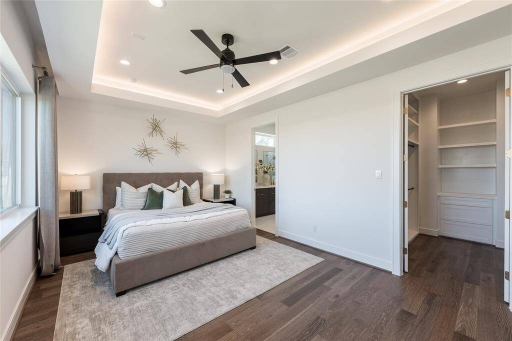 White oak floors extend throughout, enhancing the bedroom’s modern warmth.