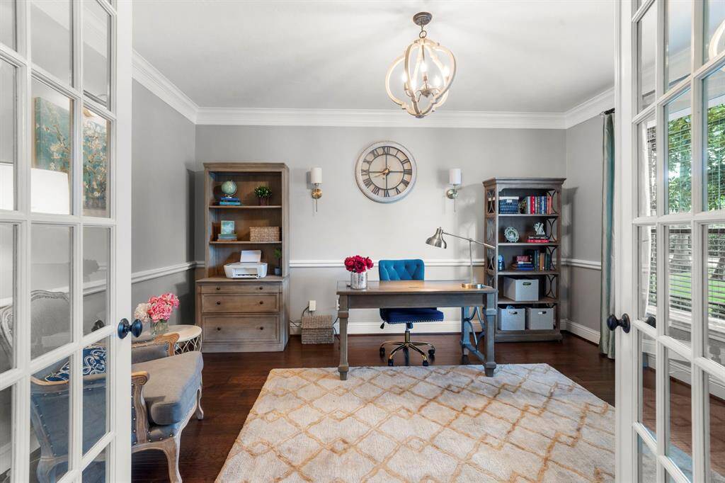 Transform your work routine into ahaven of productivity and comfort inthis thoughtfully designed homeoffice. Located behind private Frenchdoors, the room features beautiful flooring, crown molding, chair rail, chandelier, and large window that allows innatural light.