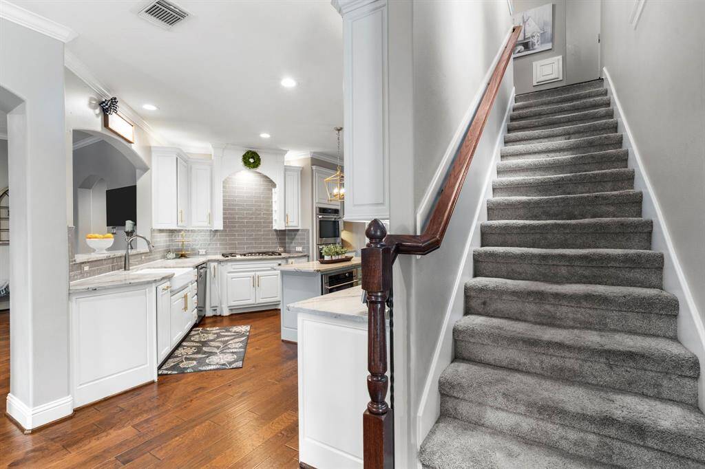 The kitchen has access to an additional staircase. to the second floor.