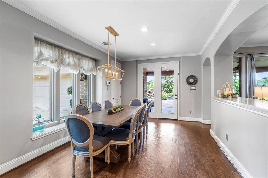 The breakfast room features windows with views in your backyardnext to the back door.