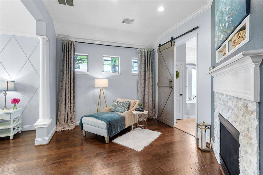 The primary bedroom also has a sitting area and cozy fireplace.