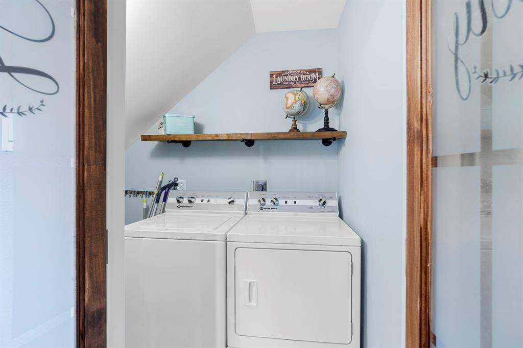 The upstairs laundry room features washer and dryer connections, andplenty of storage space.