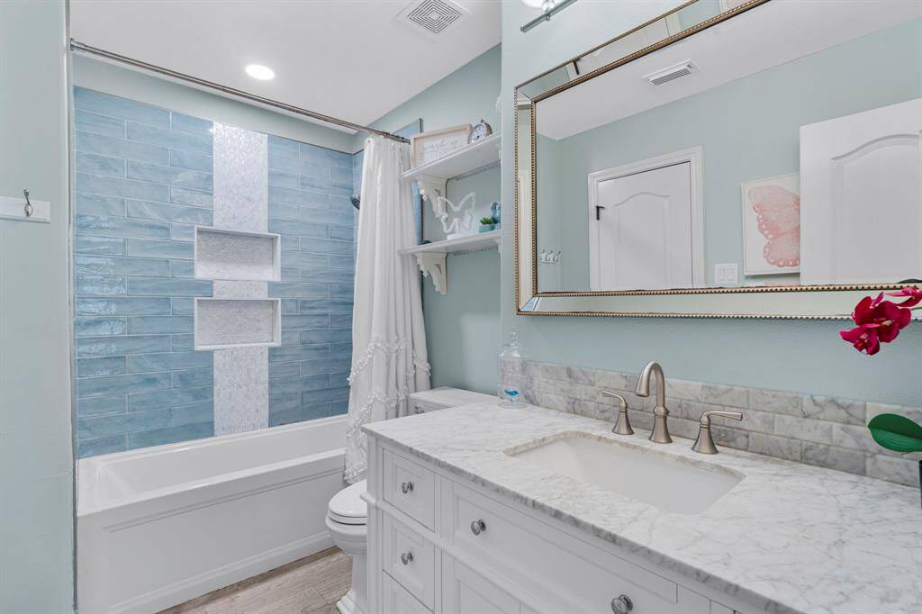 Third bathroom features atub/shower combo and long vanitywith plenty of counter space.