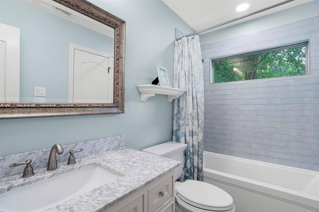 Fourth bathroom features atub/shower combo and long vanitywith plenty of counter space.