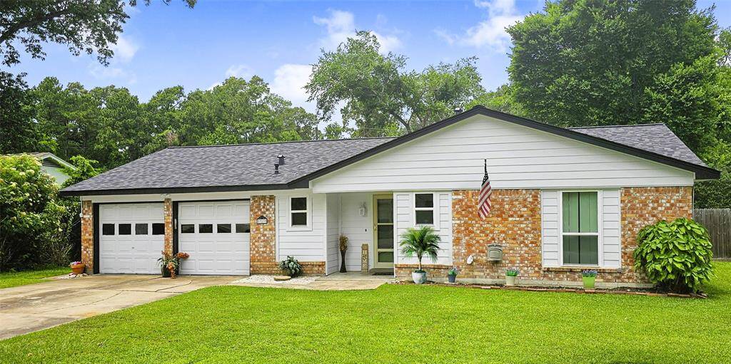 This charming single-story home features a well-maintained brick and siding exterior, a two-car garage, and a neatly landscaped front yard with mature trees in the backyard. Serene neighborhood setting with Private neighborhood access to Lake Houston!
