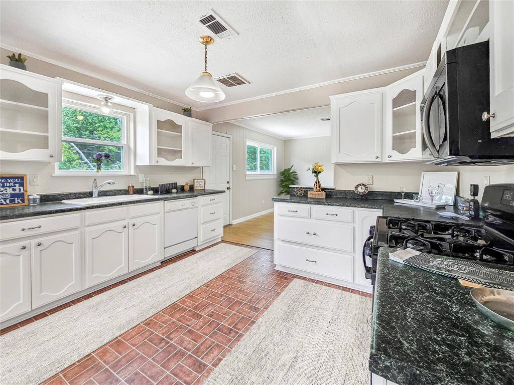 Open Kitchen and dining area with plenty of counterspace and storage - VIRTUALLY STAGED