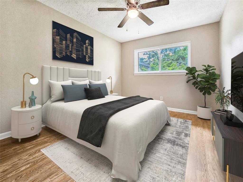 Second bedroom with ceiling fan light fixture and plenty of storage - VIRTUALLY STAGED