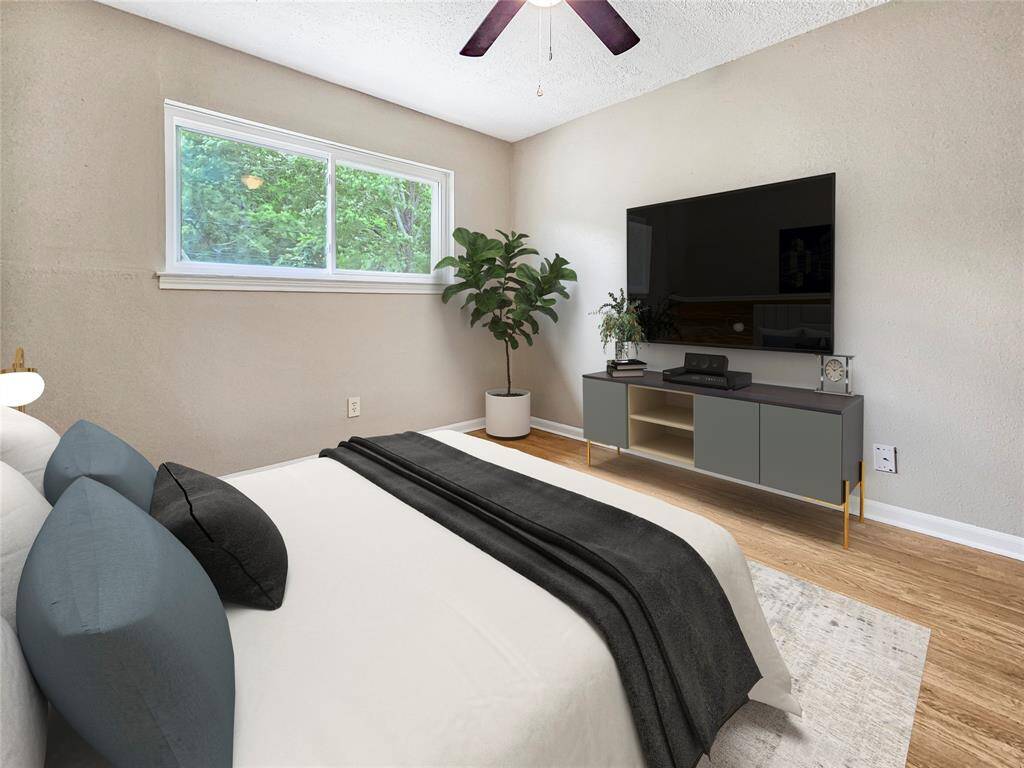 Third bedroom with ceiling fan light fixture, plenty of natural light - VIRTUALLY STAGED