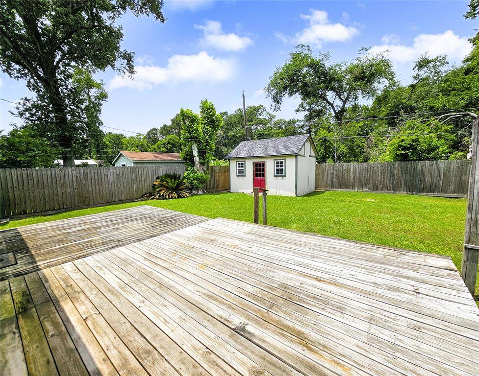 Exapnsive backyard patio/deck. So much space, so many possibilities!