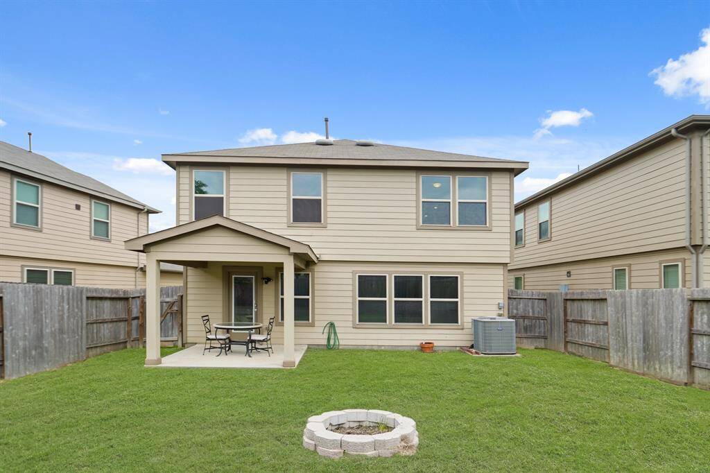 Welcome to your new backyard! Check out all of that wonderful green space for the kids and pets to run around in, and an outdoor fireplace.