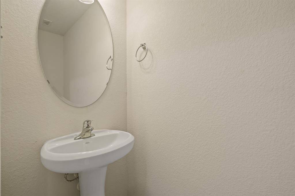 This well-appointed half bathroom is great for when you have family, friends, and guests over.