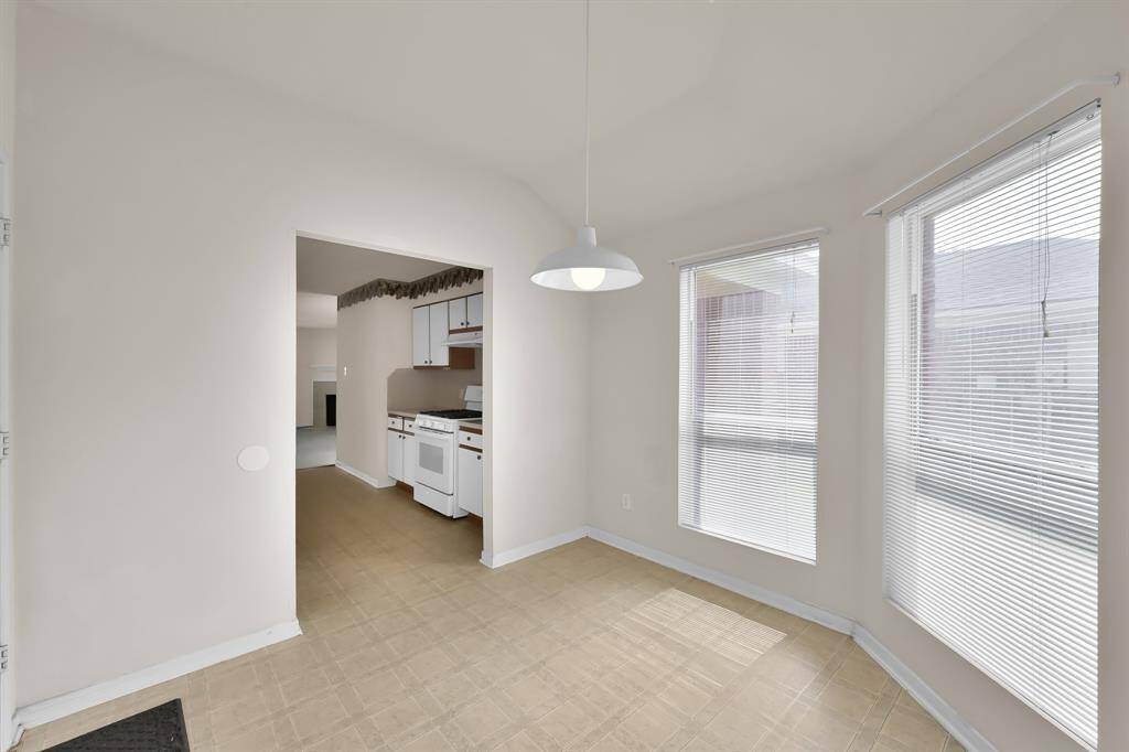 Breakfast nook, conveniently located directly off the kitchen, offers space and plenty of natural light